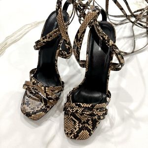 BRAND NEW- NEVER WORN strappy heels. Snakeskin print. Size 6